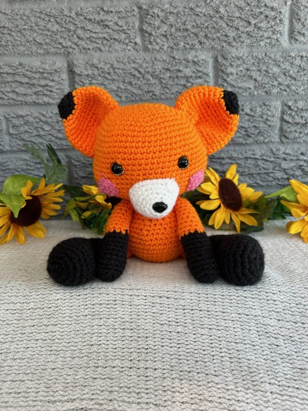 Photo of a bright orange stuffed fox