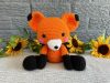 Photo of a bright orange stuffed fox