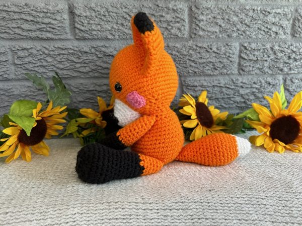 Photo of a bright orange stuffed fox