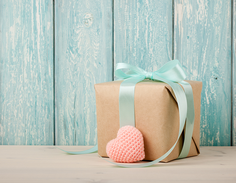 Photo of a crocheted heart with a gift box