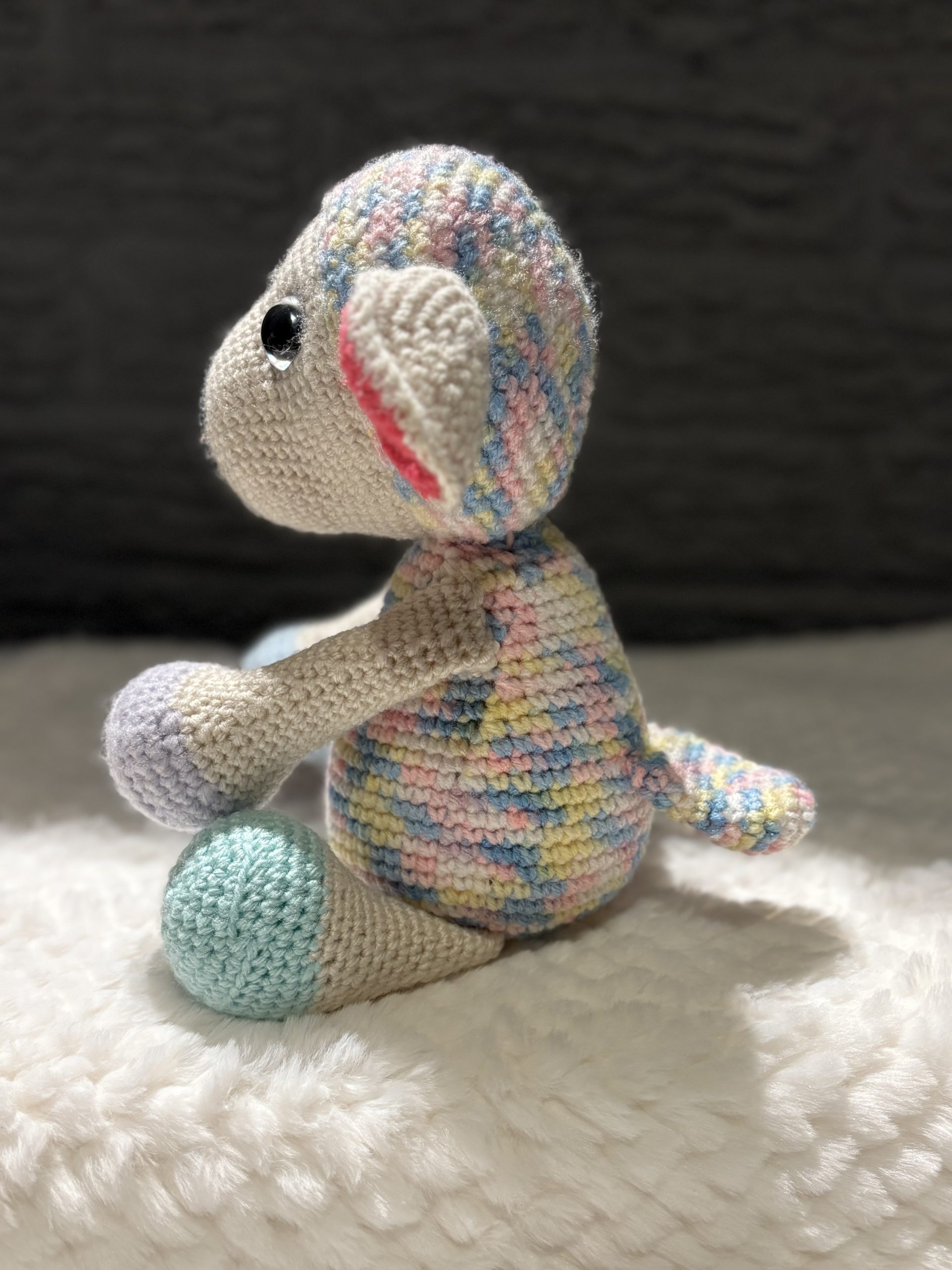 Side view of handmade crocheted baby lamb