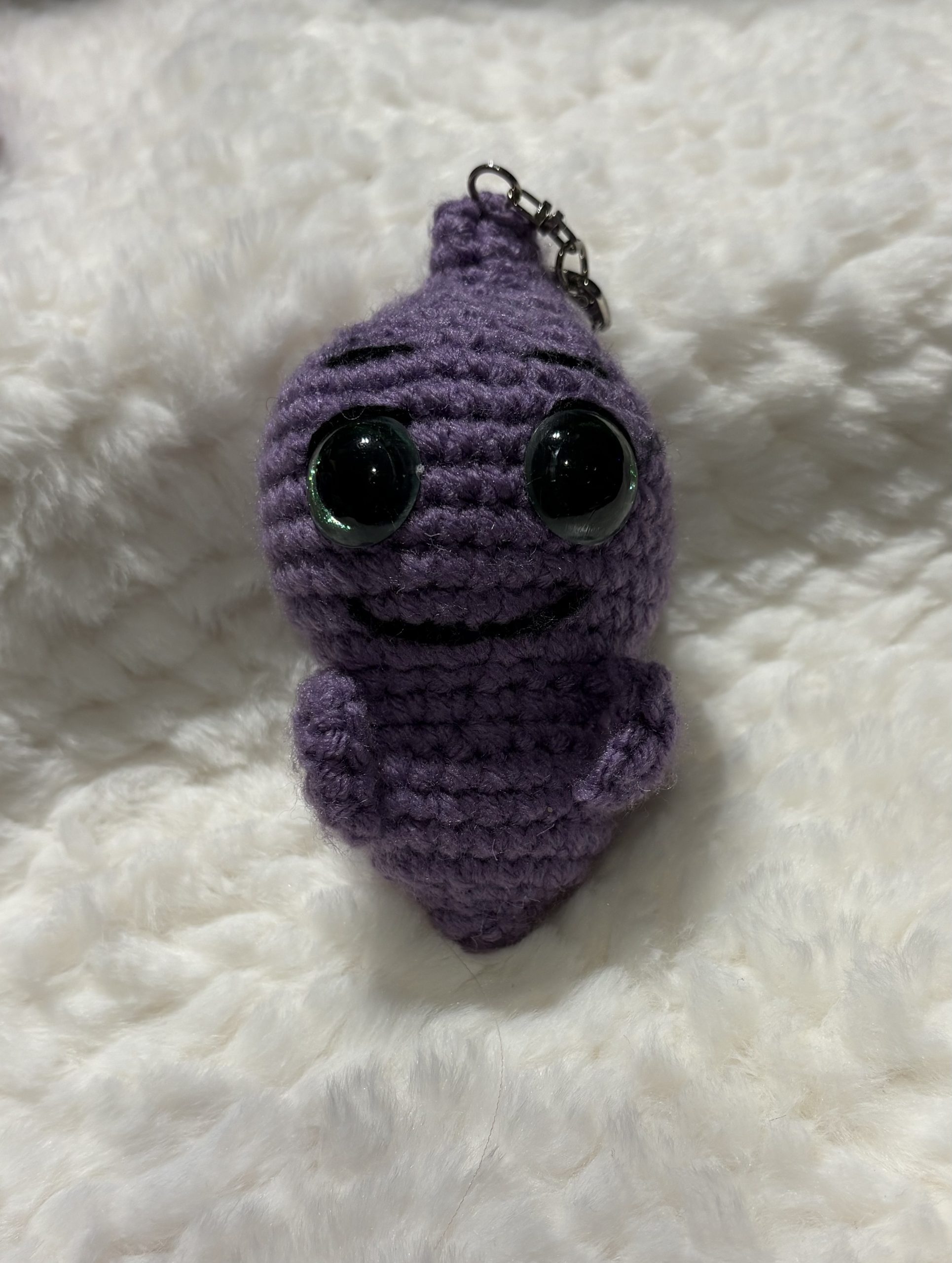 top view of handmade crochet ghost keychain