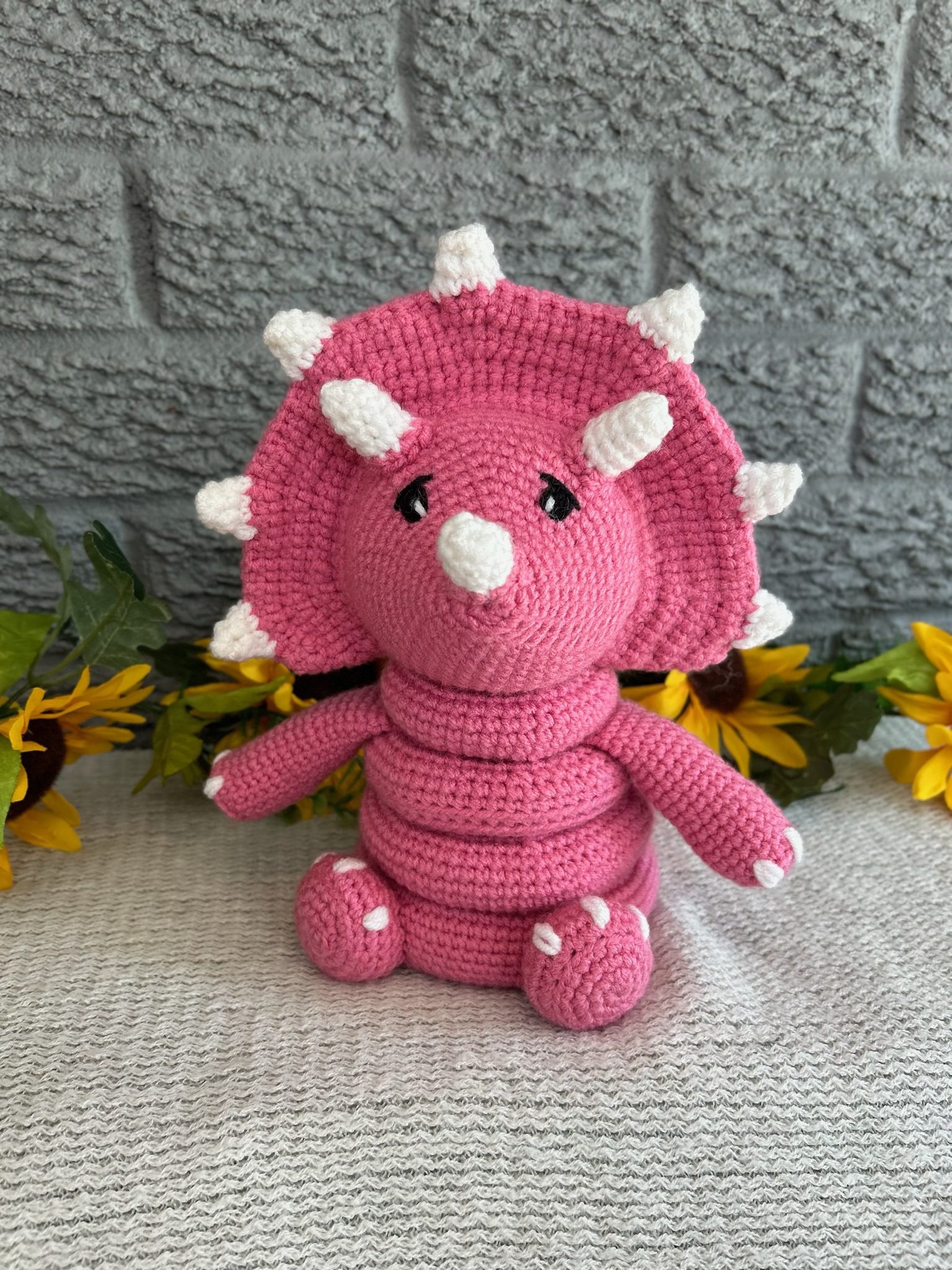 Handmade crocheted dinosaur stacking ring toy
