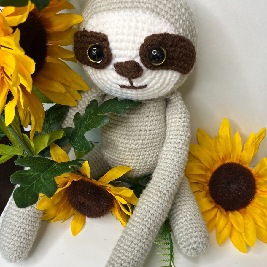 Close-up of handmade crocheted sloth