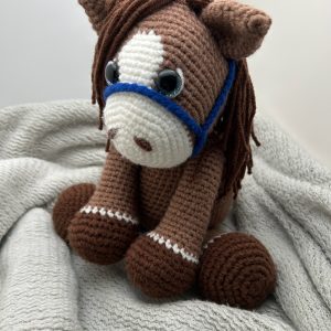 crocheted-stuff-horse-jj1.jpg close-up view of handmade crochet stuffed horse plush