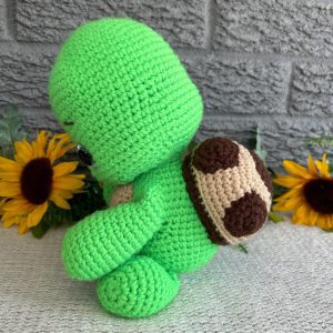 crocheted-stuffed-turtle-jj3.jpg Side view of handmade crochet turtle plush sitting upright