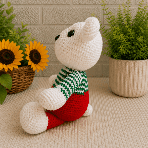 Side view of handmade crochet holiday polar bear