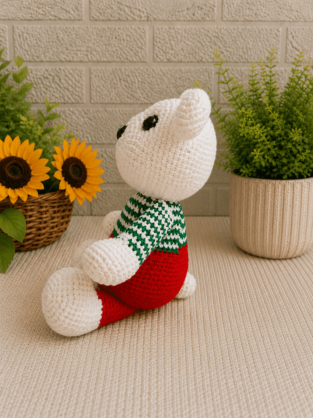 Side view of handmade crochet holiday polar bear