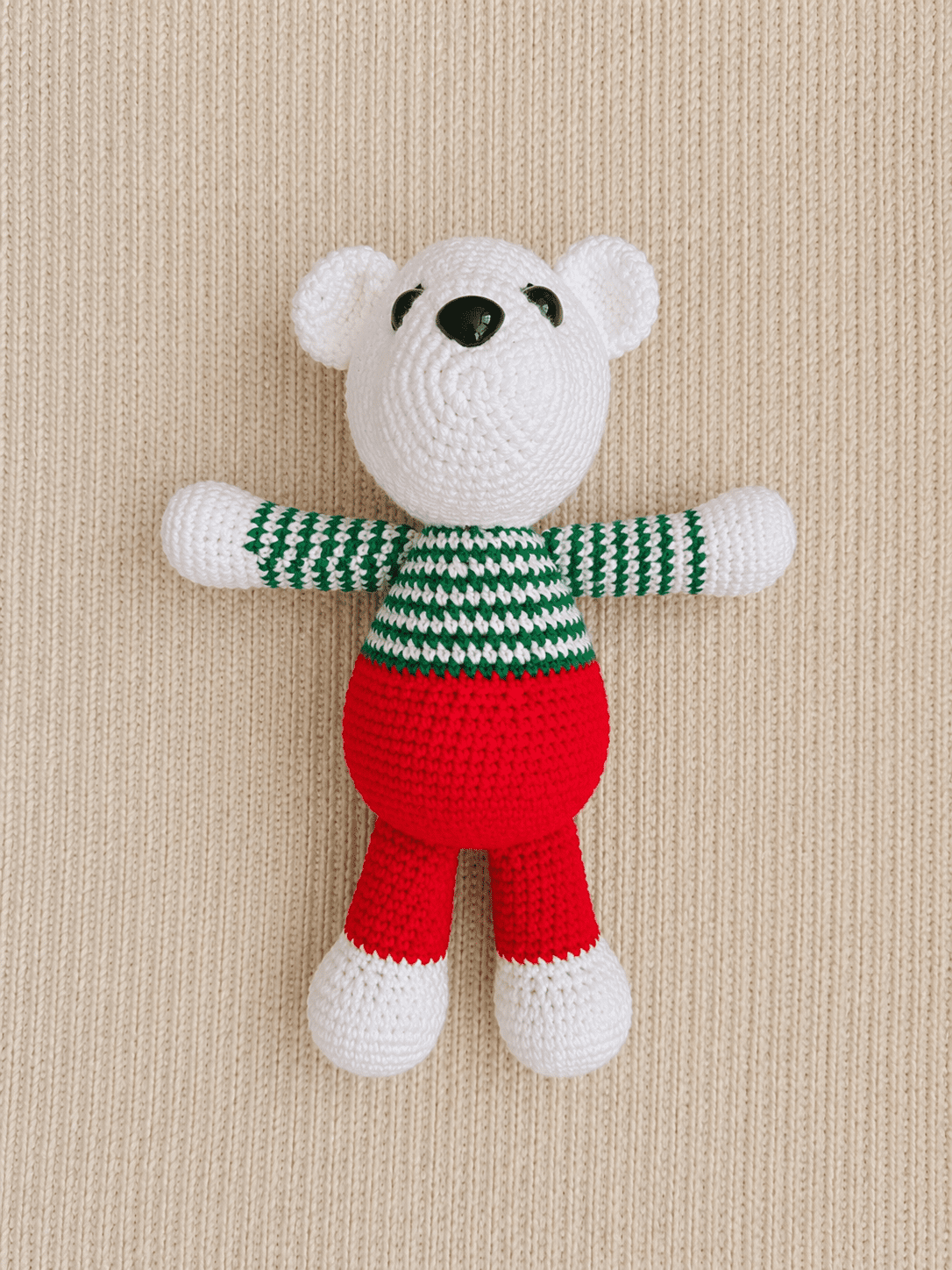 Top view of handmade crochet holiday polar bear