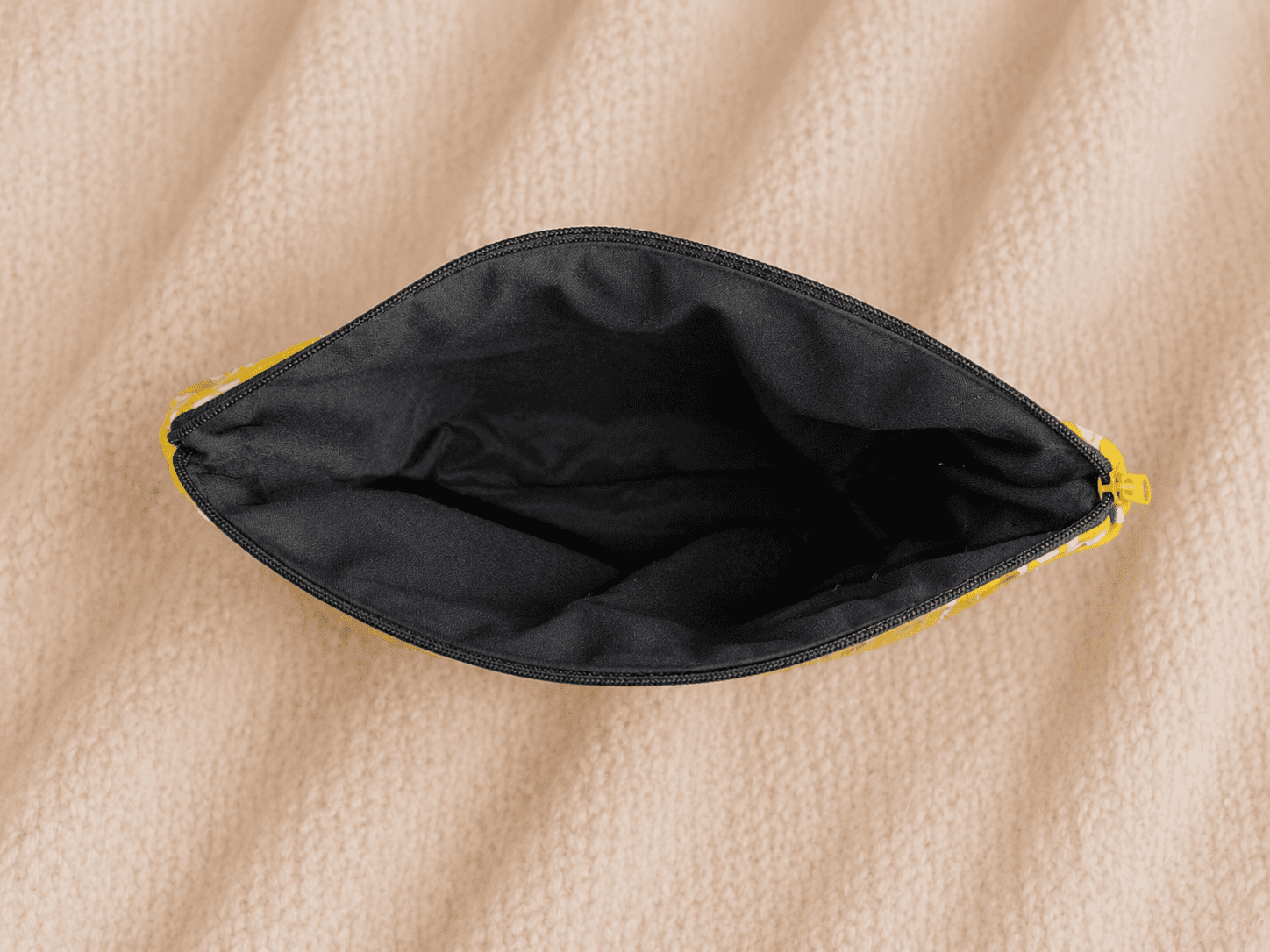 Interior of handmade bee zipper pouch with black lining