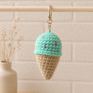 Crochet ice cream keychain hanging on display