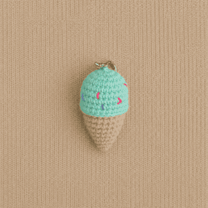 Top-crocheted-icecream-keychain Image Jul 3, 2026, 11_16_48 PM Top view of handmade crochet ice cream cone keychain