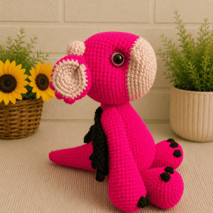 side2-crocheted-pink-dragon Image Jul 4, 2026, 12_32_55 AM Side profile of handmade crochet pink dragon plush facing left