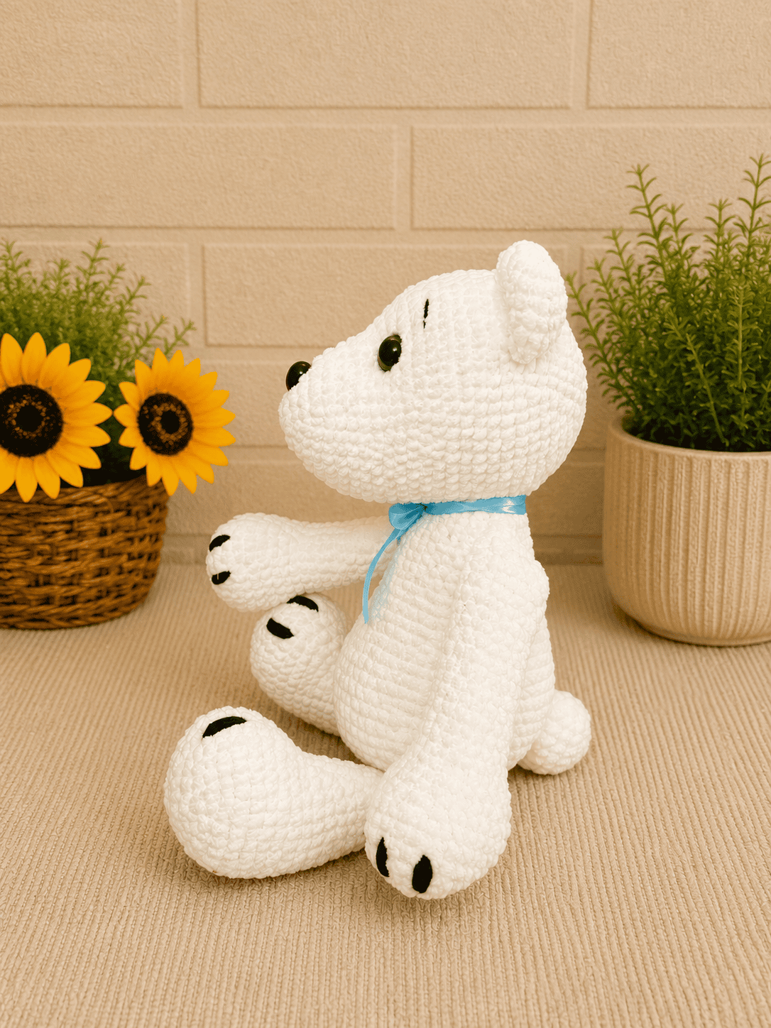 Side profile of handmade crochet polar bear.