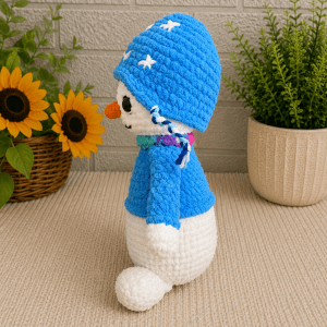 ChatGPT Image Jun 30, 2026, 11_50_38 PM Side view of handmade crochet winter snowman plush.