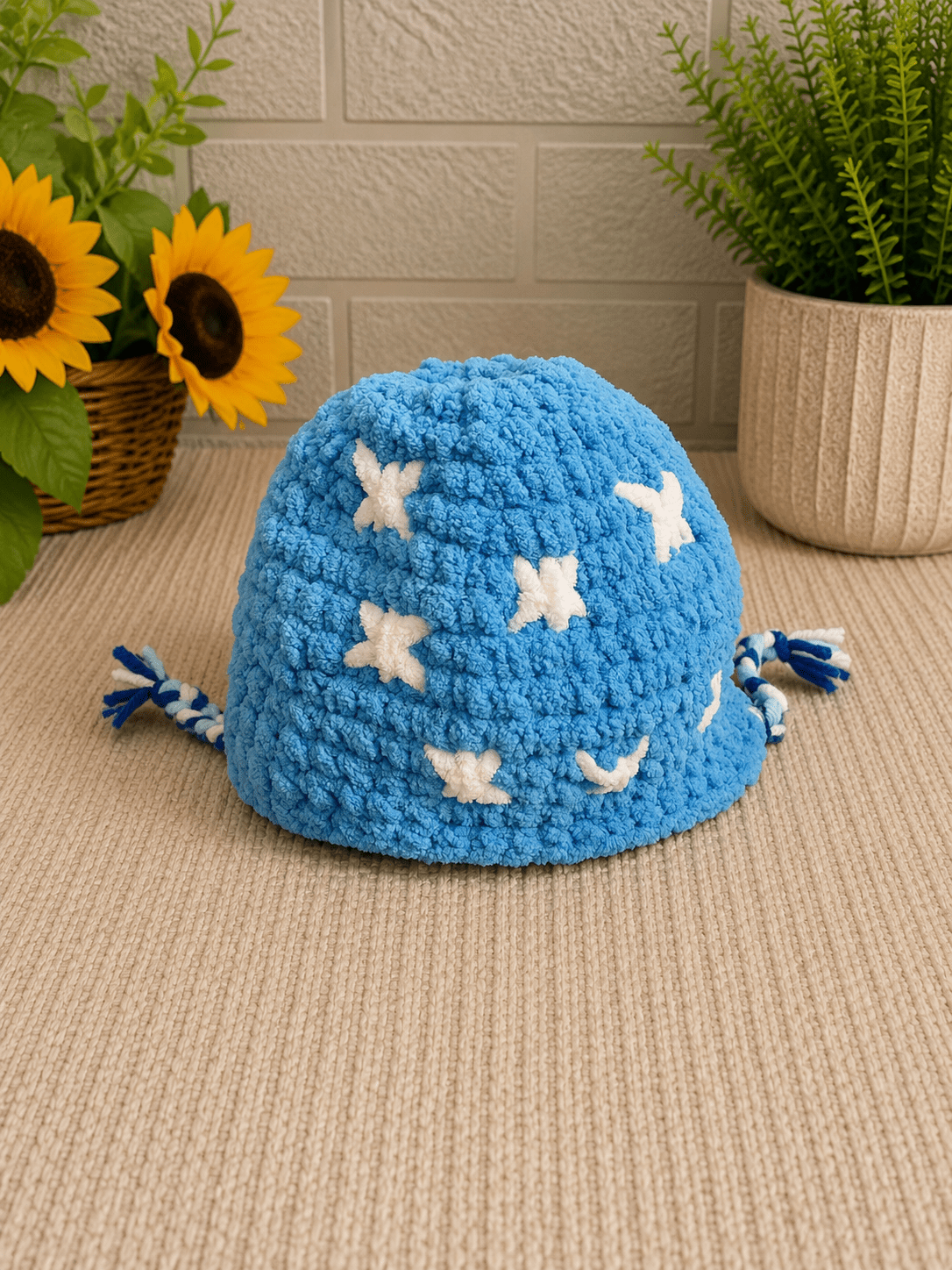Removable blue crochet winter hat with white stars for handmade snowman plush.